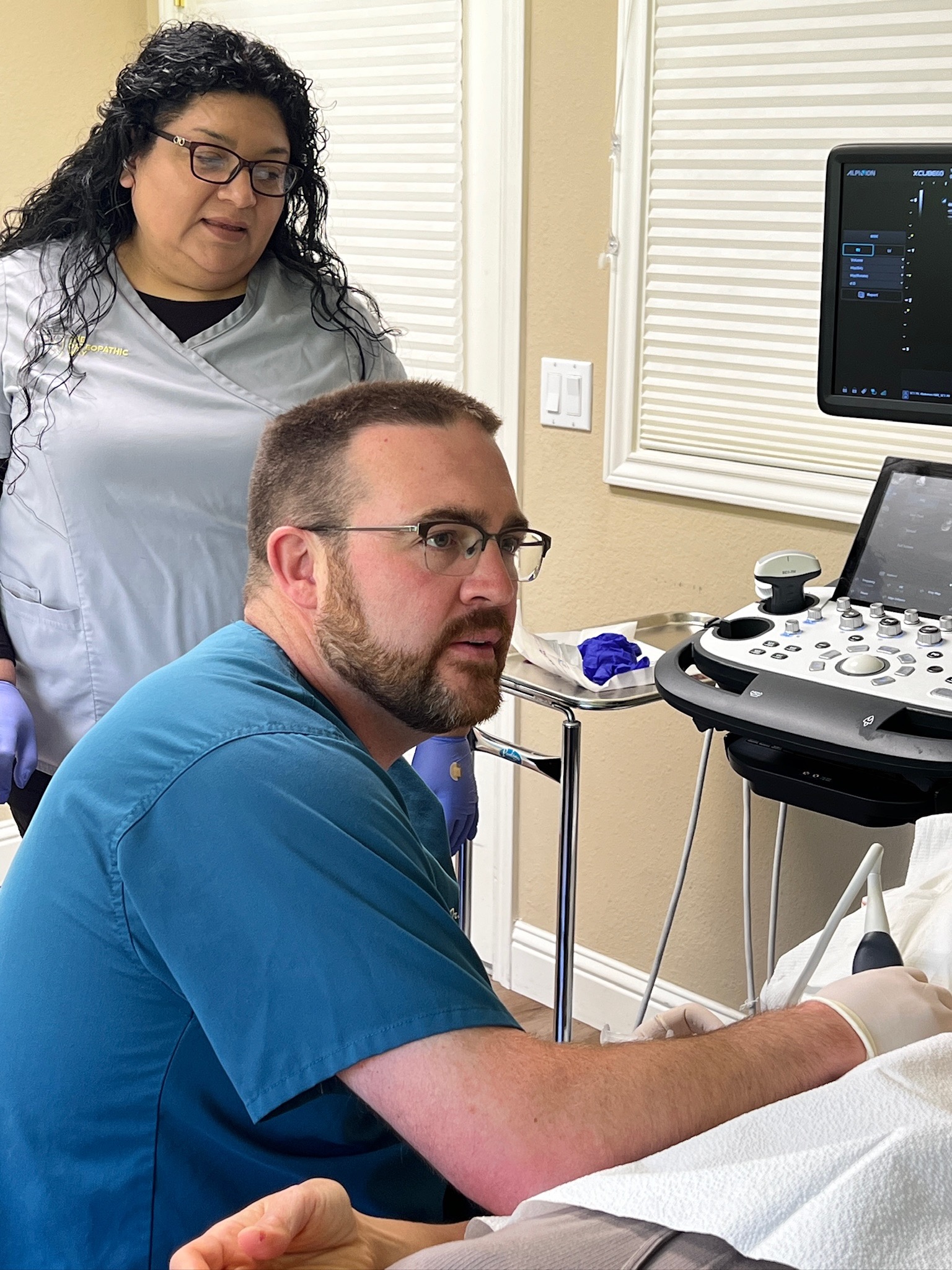 Dr. Josh Fischer, DO, performing an ultrasound-guided procedure
